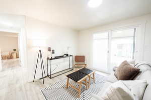 Living area featuring wood finished floors and baseboards