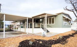 View of home's exterior with a carport and a porch