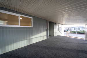 View of patio / terrace featuring a carport