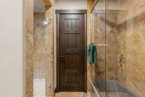 Full bathroom with tiled shower / bath combo