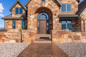 View of exterior entry with stone siding