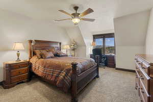 Bedroom with light colored carpet and ceiling fan