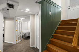 Staircase featuring carpet floors and recessed lighting