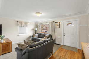 Living room with baseboards and light wood finished floors