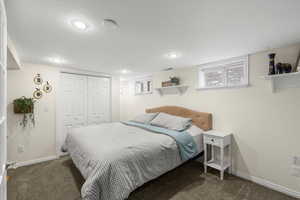 Bedroom with a closet and carpet floors