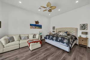 Bedroom with wood finished floors, lofted ceiling, recessed lighting, and a ceiling fan