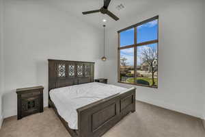 Bedroom featuring light carpet, ceiling fan, and recessed lighting