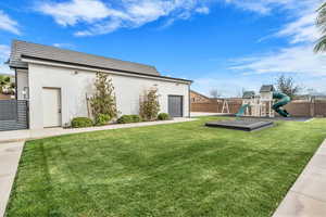 Fenced backyard with an attached garage