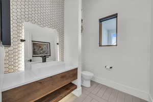 Bathroom with toilet and vanity