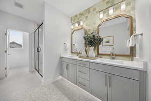 Owner's Bath with double vanity and a stall shower