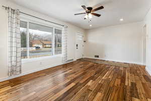 Empty room with hardwood / wood-style floors, ceiling fan, recessed lighting, and a textured ceiling