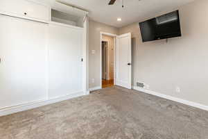 Unfurnished bedroom featuring carpet flooring, ceiling fan, and recessed lighting