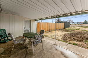 View of patio with outdoor dining space