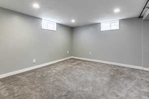 Below grade area featuring carpet flooring and recessed lighting