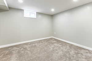 Basement with carpet and recessed lighting