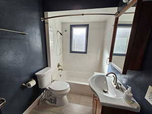 Bathroom featuring vanity and shower / washtub combination