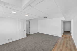 Finished below grade area featuring recessed lighting and a drop ceiling