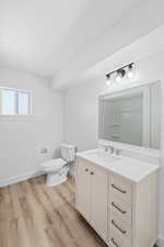Bathroom with vanity and light wood-style flooring