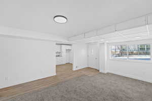 Empty room with baseboards and light wood-style floors
