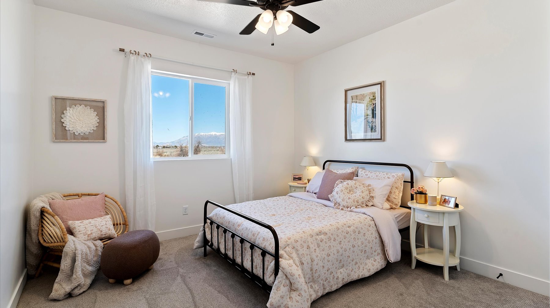 Bedroom with a ceiling fan and carpet floors