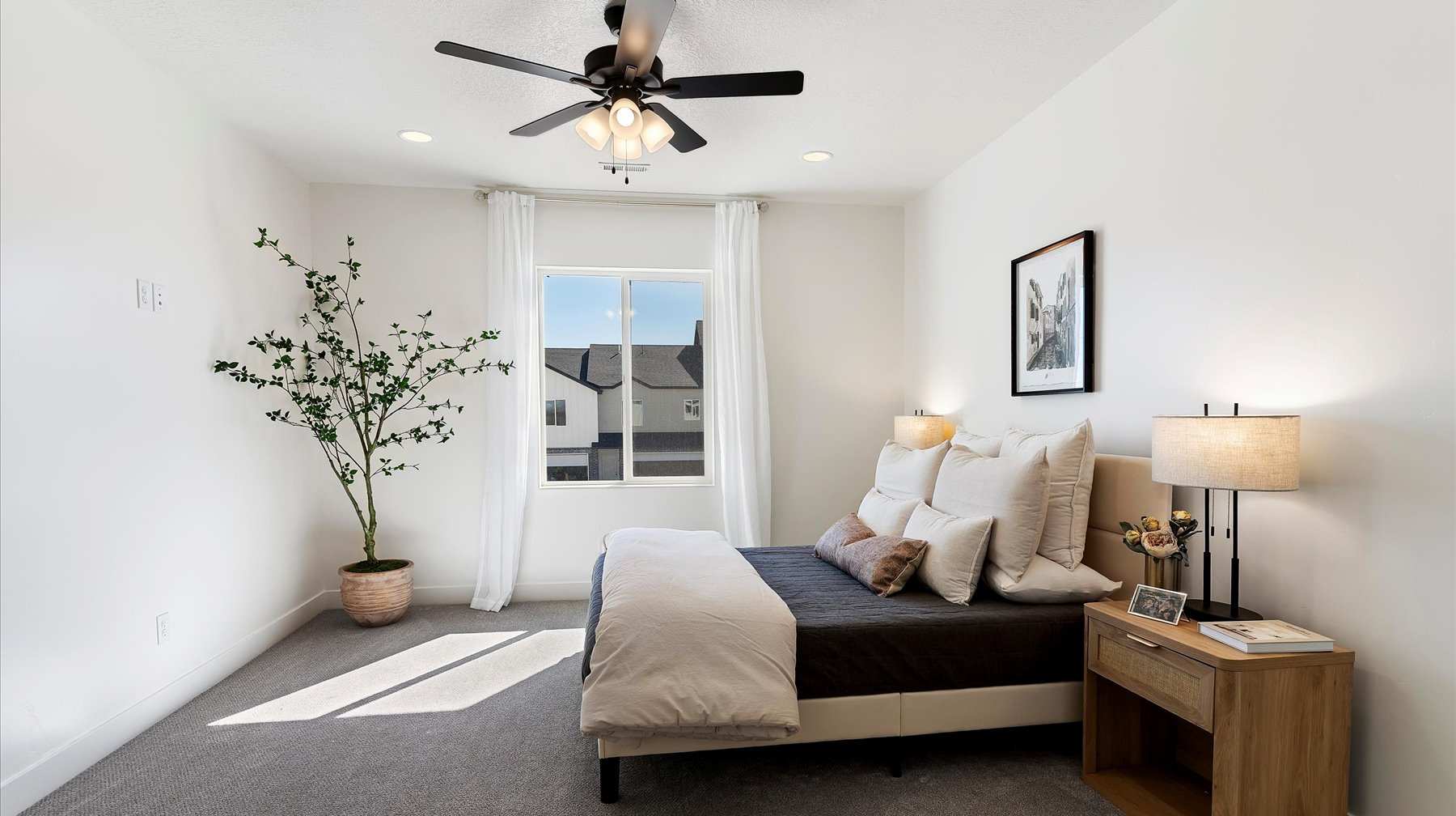 Carpeted bedroom with ceiling fan and recessed lighting