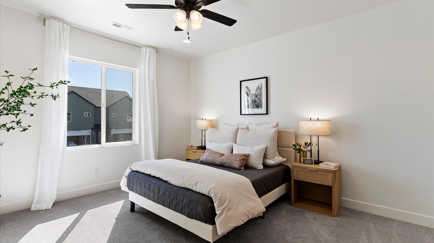 Bedroom with carpet floors and a ceiling fan