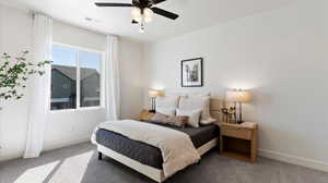 Bedroom with carpet floors and a ceiling fan