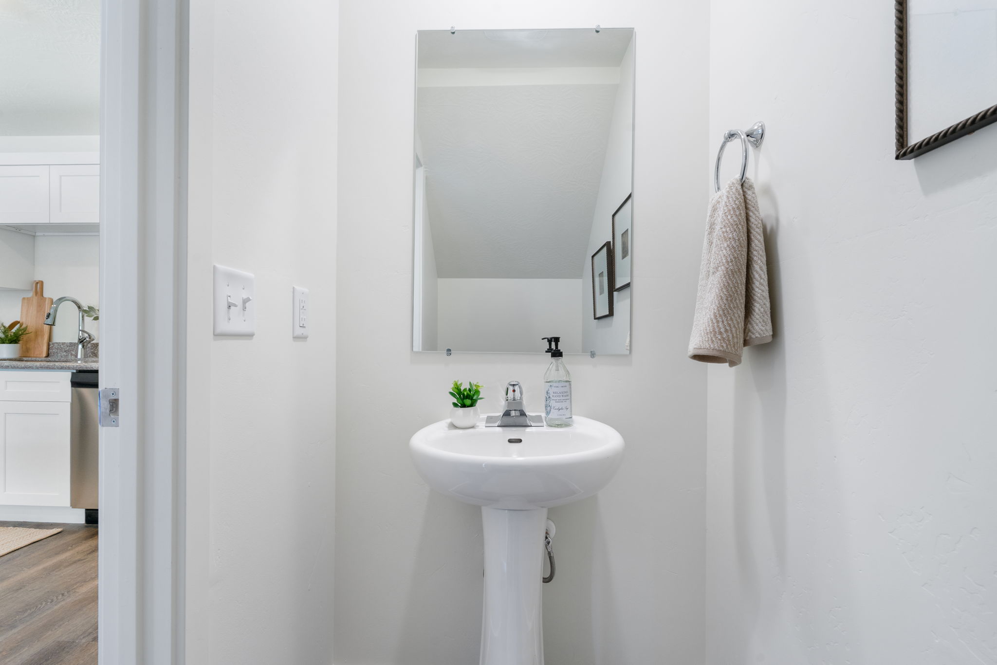 Bathroom featuring a sink and wood finished floors