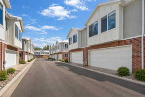 View of asphalt street featuring a residential view