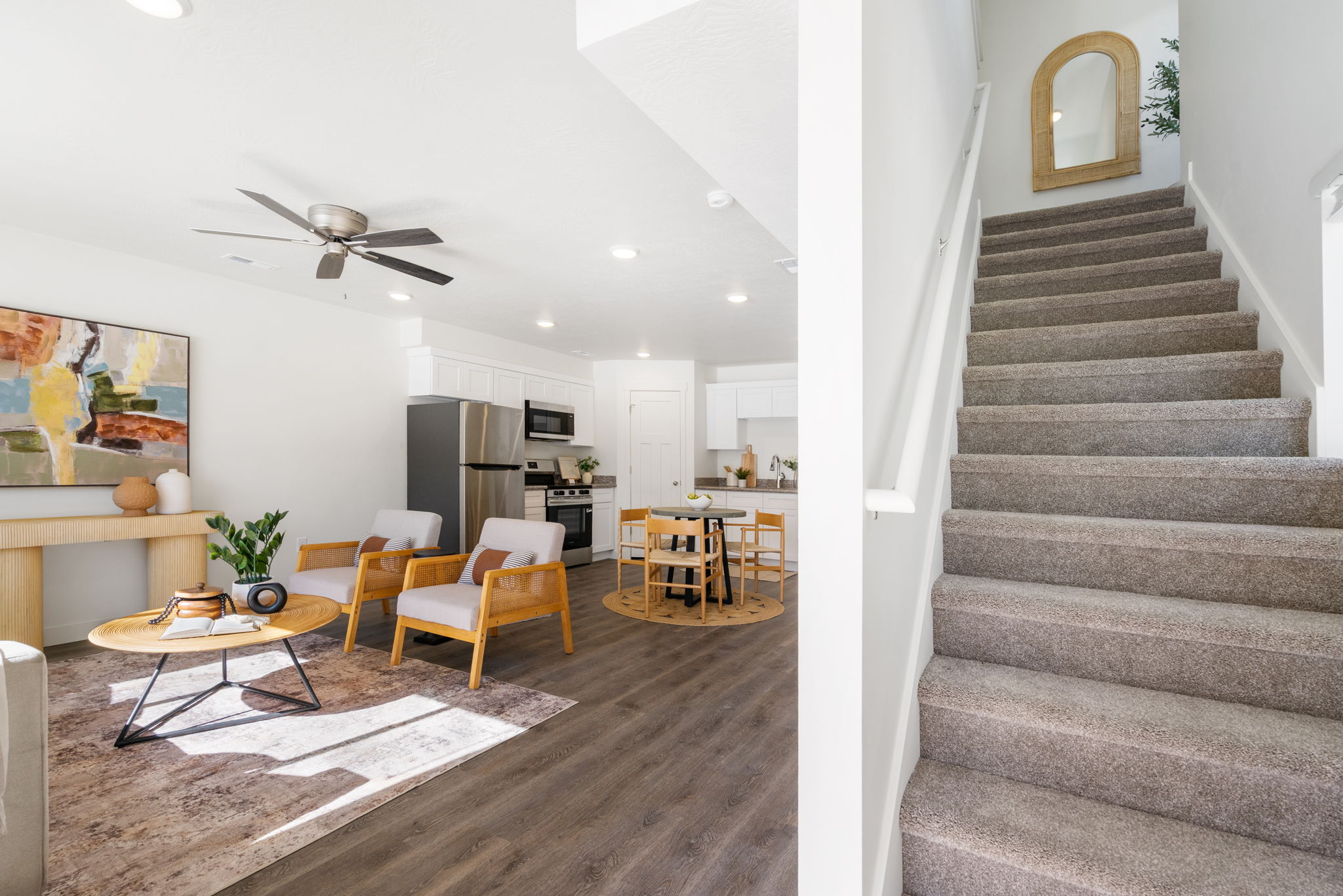 Staircase featuring ceiling fan, wood finished floors, and recessed lighting