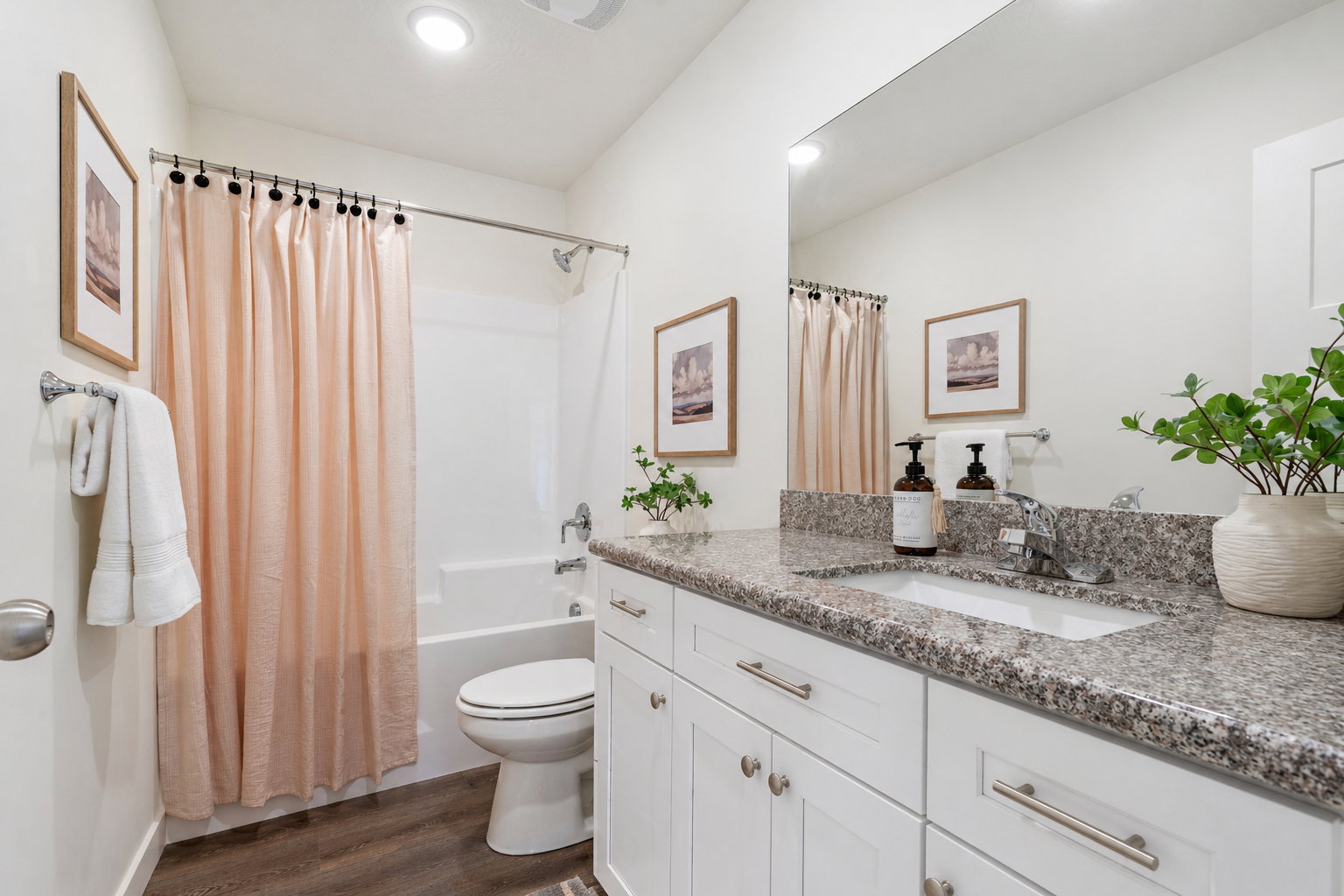 Bathroom with vanity, dark wood-style flooring, shower / bathtub combination with curtain, and recessed lighting