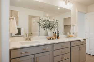 Bathroom with double vanity and a closet