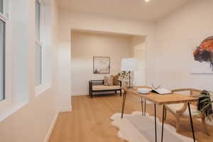 Office area featuring wood finished floors and baseboards