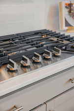 Kitchen view of stainless steel gas cooktop