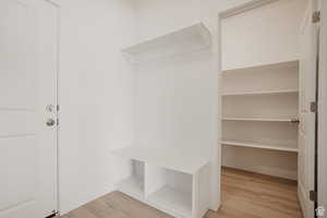 Mudroom with light wood finished floors