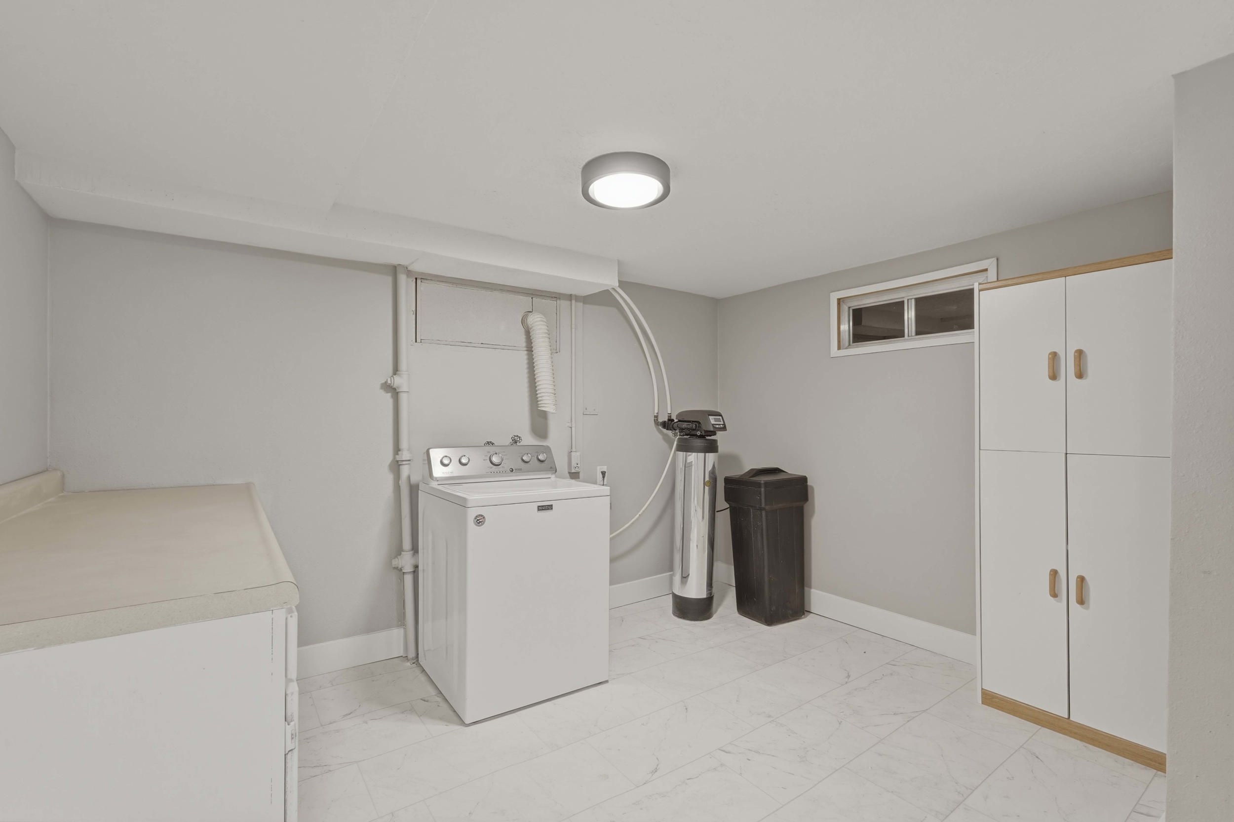 Large laundryroom with potential to add a kitchenette or another half bathroom.