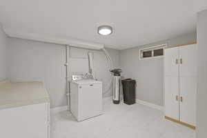 Large laundryroom with potential to add a kitchenette or another half bathroom.