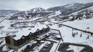 Snowy aerial view featuring a mountain view