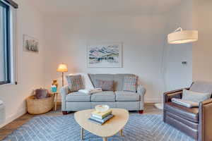 Living room with wood finished floors and baseboards