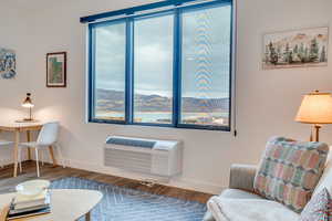 Living area featuring baseboards and wood finished floors