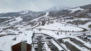 Snowy aerial view featuring a mountain view