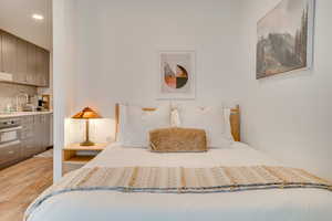 Bedroom featuring light wood-style floors and recessed lighting