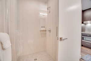 Full bath with tiled shower