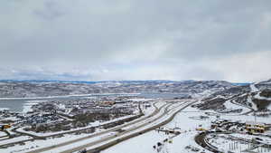 Snowy aerial view featuring a mountain view