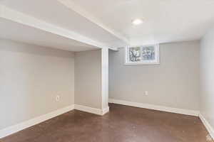 Below grade area featuring baseboards