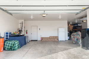 Garage with freestanding refrigerator