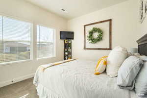 Bedroom with carpet flooring and baseboards