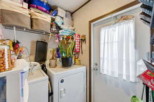 Laundry room featuring separate washer and dryer
