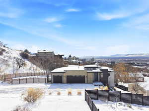 Contemporary house with a mountain view and stone siding
