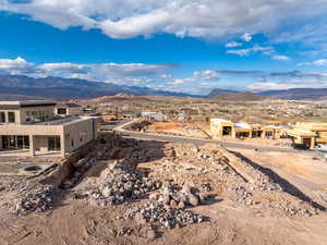 View of mountain backdrop featuring nearby suburban area